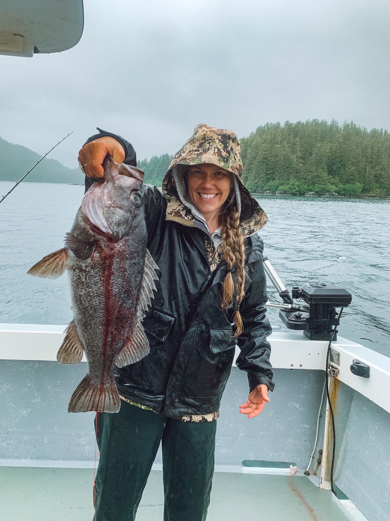 Three anglers holding rockfish caught in Alaska