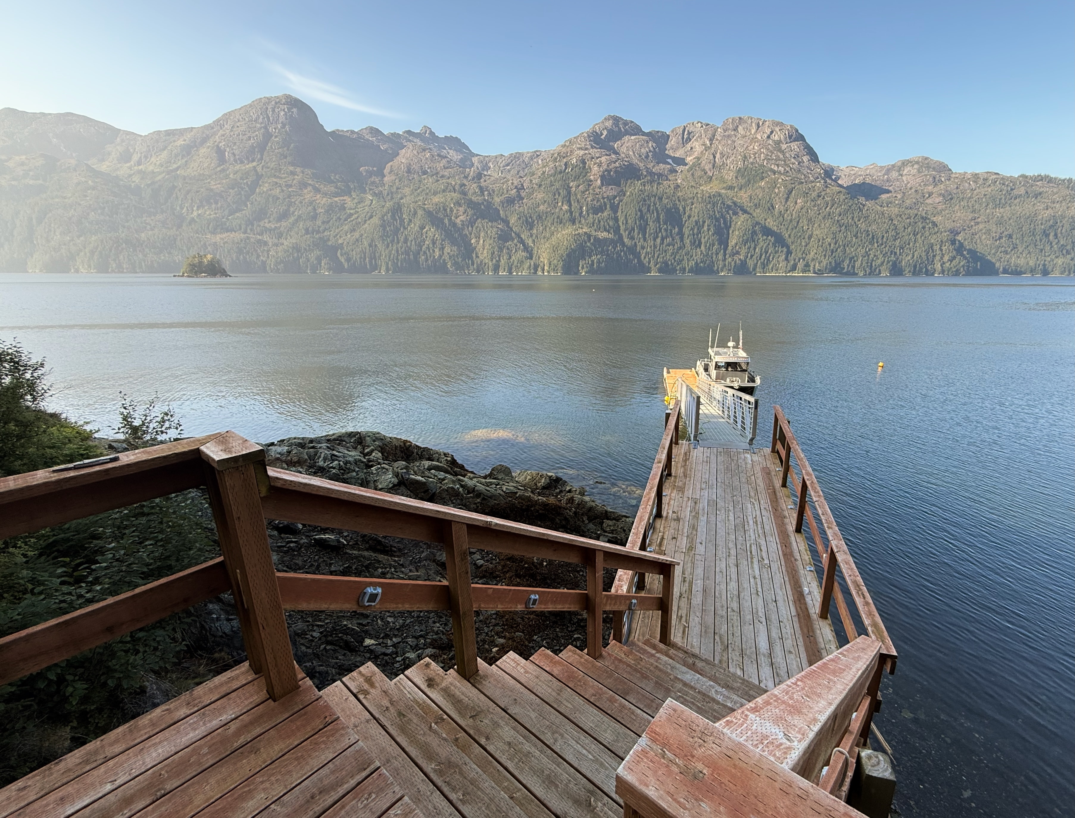 Private dock at Wild Alaskan Lodge with calm Alaskan waters